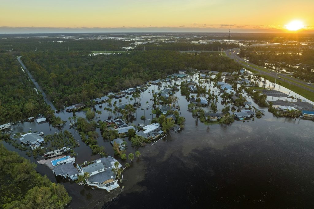 Surrounded by hurricane Ian rainfall flood waters homes in Florida residential area.